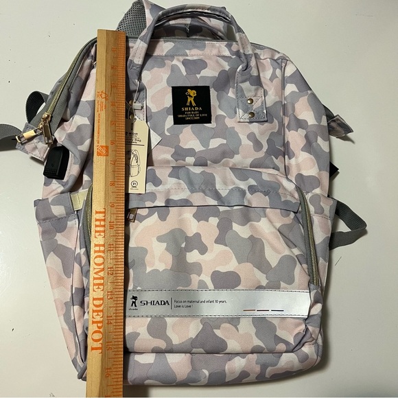 Shiada brand diaper bag backpack with a camouflage pattern in grey, pink, &white - Picture 13 of 15